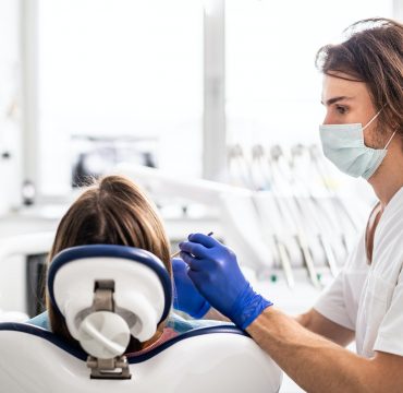 A dental check-up of patient in dentist surgery